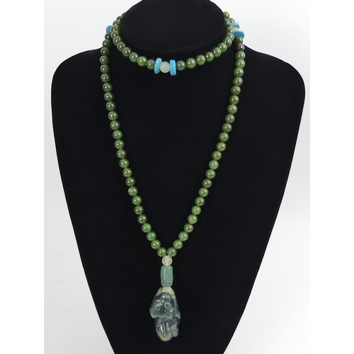 93 - Carved Chinese jade/nephrite and turquoise bead necklace with a temple lion pendant, 138 grams, bead... 