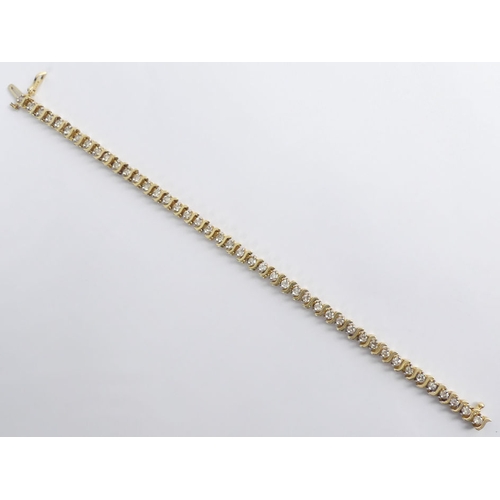 98 - 14ct gold, diamond 'S' line bracelet, approximately 3.5ct, 17.5cm x 5mm.