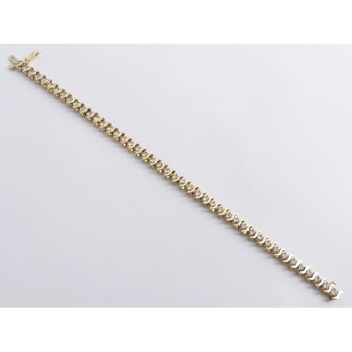 98 - 14ct gold, diamond 'S' line bracelet, approximately 3.5ct, 17.5cm x 5mm.