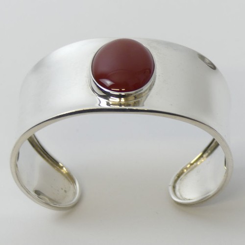 63 - Sterling silver and amber foliate design cuff bangle, 13.9 grams, 17mm.