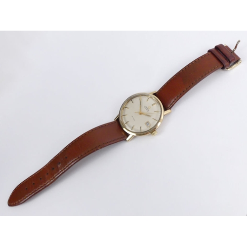 106 - Gents 9ct gold Omega De Ville automatic date adjust watch on a brown leather strap, dating from C.19... 