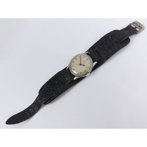 110 - 1940's Omega military issue manual wind movement gents watch, on a black leather strap, 35mm.
Condit... 