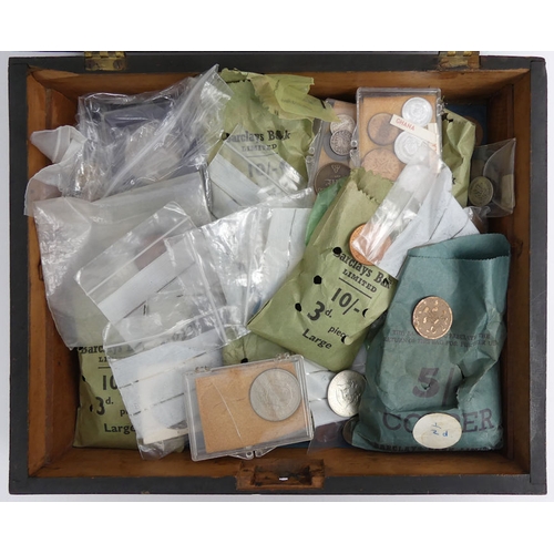 132 - A mahogany box of mixed British and foreign coins, including some silver examples.