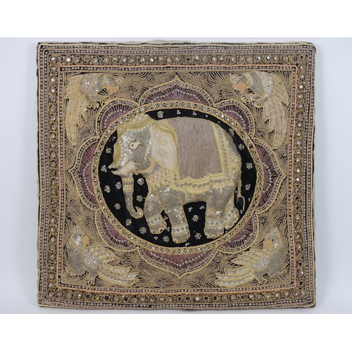 488 - An Indian embroidery of an elephant, 62cm x 64cm.