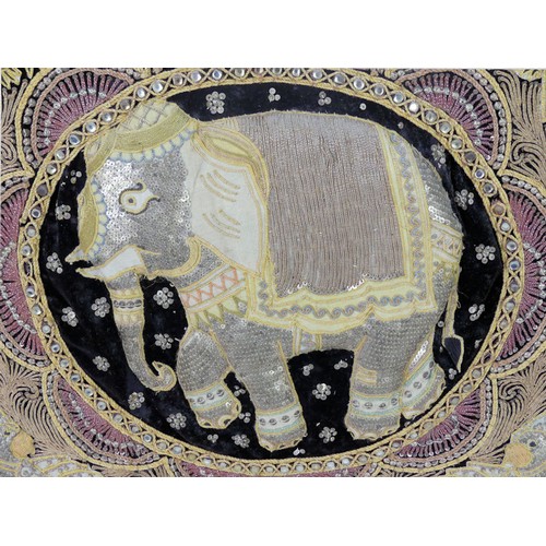 488 - An Indian embroidery of an elephant, 62cm x 64cm.