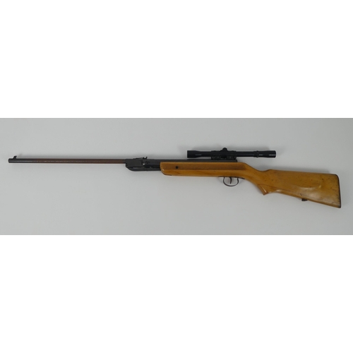 185 - A .177 air rifle with scope, marked foreign. Length 109cm.