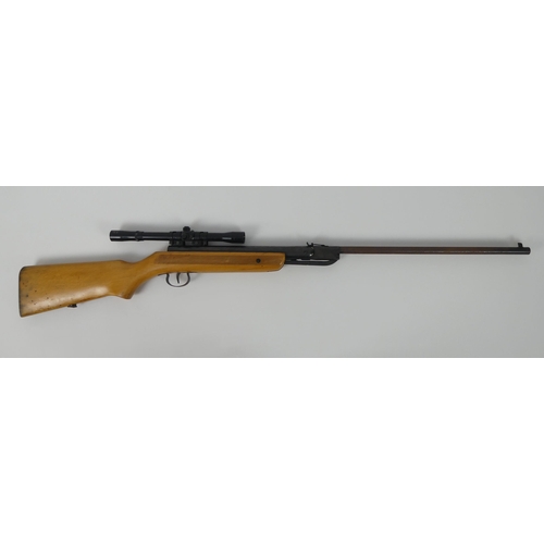 185 - A .177 air rifle with scope, marked foreign. Length 109cm.