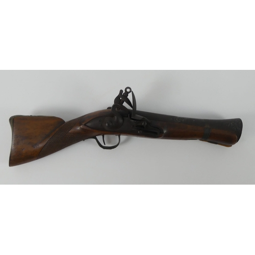 192 - A flintlock mahogany stock blunderbuss with brass fittings, marked 84-86 to the barrel. Length 39 cm... 