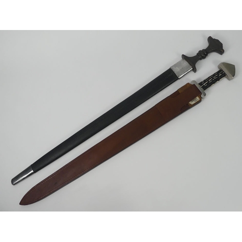 222 - Two John Barnett Ancient Warrior collection swords in scabbards,, 75cm.