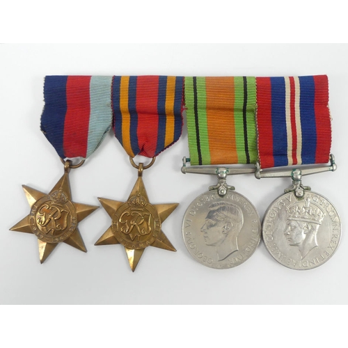 232 - WWII four medal group, 39-45 star, Burma star, Defence Medal and Service Medal.