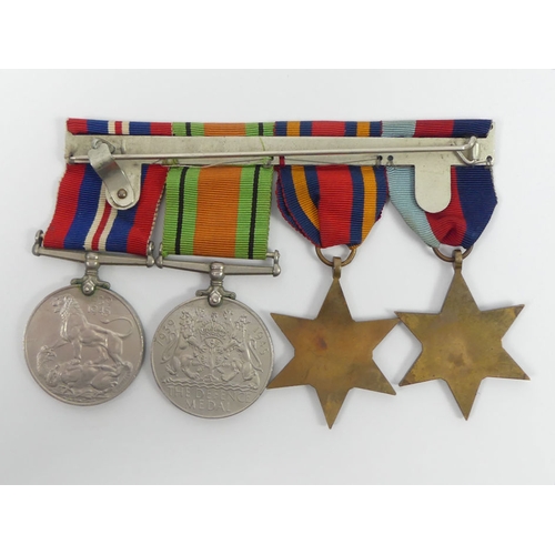 232 - WWII four medal group, 39-45 star, Burma star, Defence Medal and Service Medal.