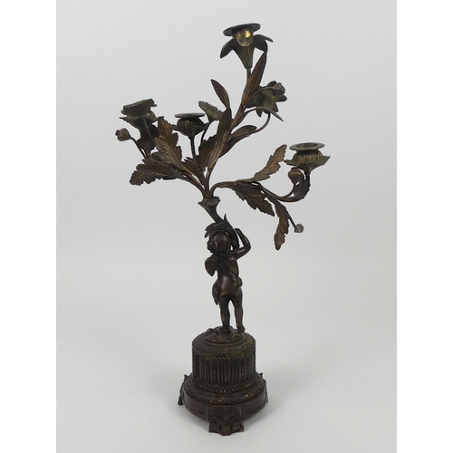 260 - 19th century bronze figural candelabrum with an inset porcelain panel. 46cm high.