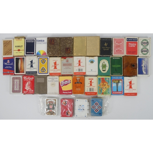 265 - A large collection of playing cards, predominantly advertising examples.