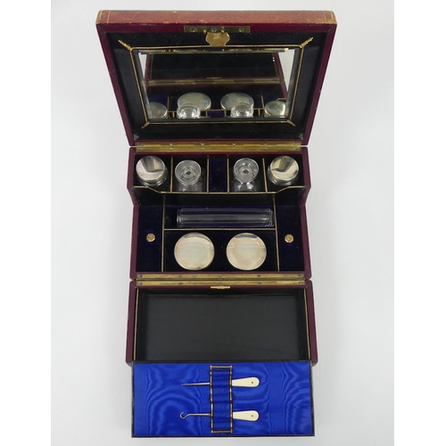 277 - Late 19th century leather ladies vanity box opening to reveal fitted compartments with perfume bottl... 