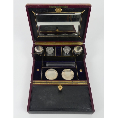 277 - Late 19th century leather ladies vanity box opening to reveal fitted compartments with perfume bottl... 