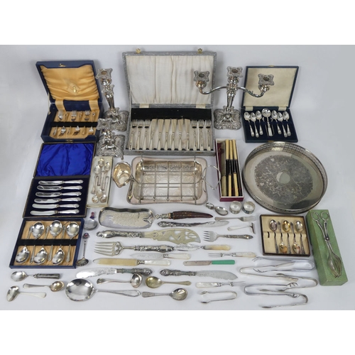 280 - A box of silver plate, including boxed cutlery, candlesticks.