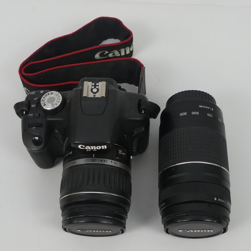 288 - Canon EOS 500D camera together with a Canon 200m lens EF 75 - 300m, in fitted case, 18cm x 18cm.