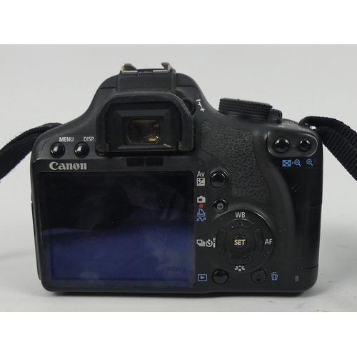 288 - Canon EOS 500D camera together with a Canon 200m lens EF 75 - 300m, in fitted case, 18cm x 18cm.