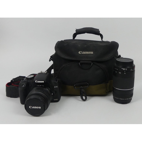 288 - Canon EOS 500D camera together with a Canon 200m lens EF 75 - 300m, in fitted case, 18cm x 18cm.