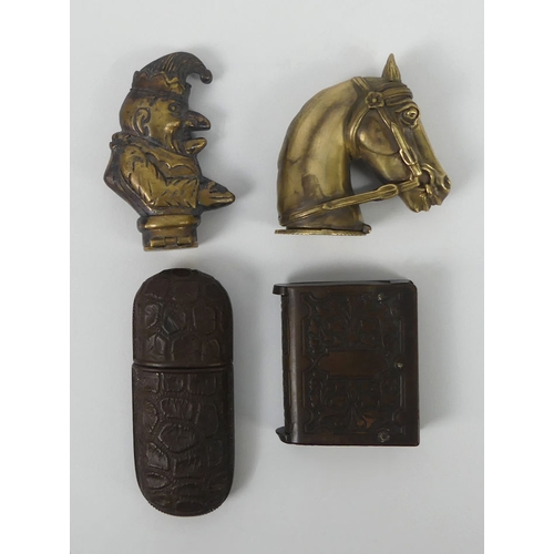 293 - Four novelty vesta cases including a brass Mr Punch and a horses head. Largest 7 cm.