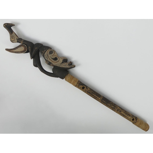 305 - A ritual ceremonial staff figurehead with hornbill headress from Paua New Guinea. 80 cm long.