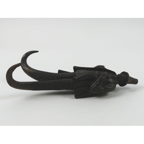 306 - Black Forest finely carved wood and chamois horn coat hook in the form of a hunter. 23 cm high.