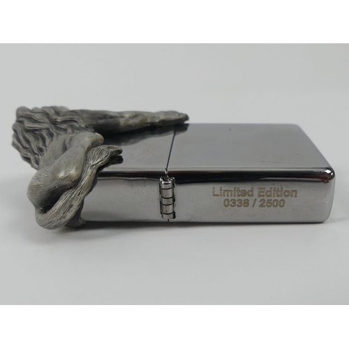 312 - A limited edition Zippo lighter No 338/2500 with figure of a lion to the flip top, boxed with instru... 