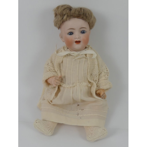 320 - Kammer & Reinhardt bisque headed doll with composition body, impressed marks to head, 36cm.