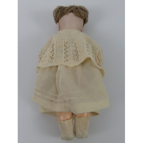 320 - Kammer & Reinhardt bisque headed doll with composition body, impressed marks to head, 36cm.