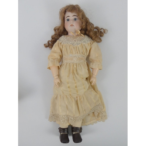 321 - Armand Marseille bisque headed doll, 3700 with composition body, impressed marks to neck, 51cm.