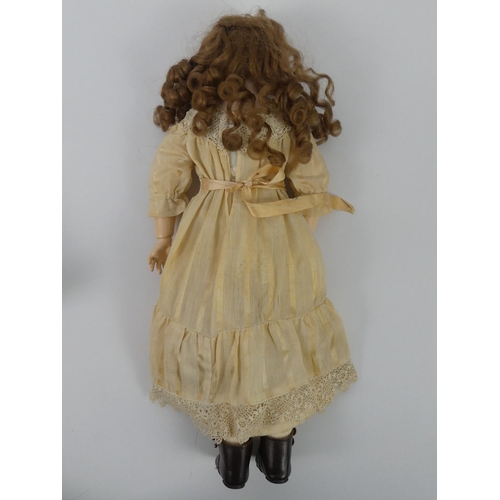 321 - Armand Marseille bisque headed doll, 3700 with composition body, impressed marks to neck, 51cm.