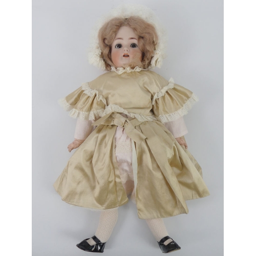 322 - Kammer & Reindhardt bisque headed doll 55 with impressed marks to head, 54cm.