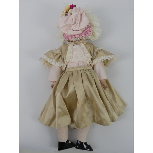 322 - Kammer & Reindhardt bisque headed doll 55 with impressed marks to head, 54cm.