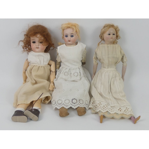 328 - Two Armand Marseille dolls, impressed marks to head together with a wax doll, tallest 40cm.