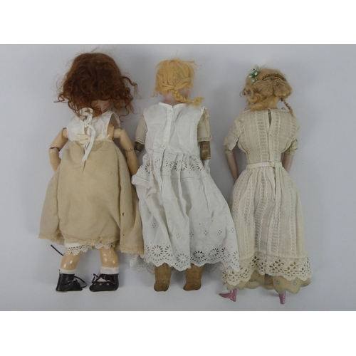 328 - Two Armand Marseille dolls, impressed marks to head together with a wax doll, tallest 40cm.