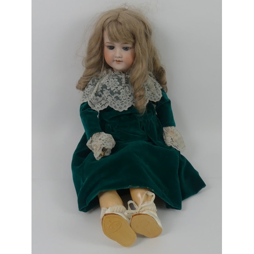 330 - Armand Marseille bisque headed doll 390, composition body and with impressed marks to head, 69cm.