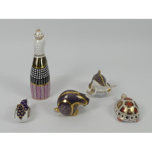 343 - Five Royal Crown Derby paperweights, a dolphin, badger, tortoise, royal cat and a bird, tallest 22.5... 