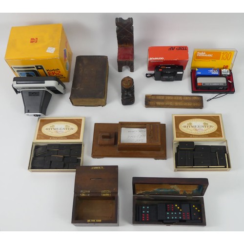 281 - A box of items, including a leather bound Bible, dominoes sets and boxed Kodak cameras.