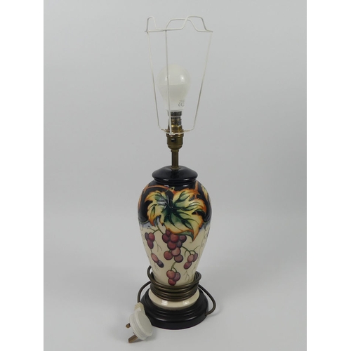 350 - A Moorcroft lamp 'Fruiting Vine' pattern, 57cm.