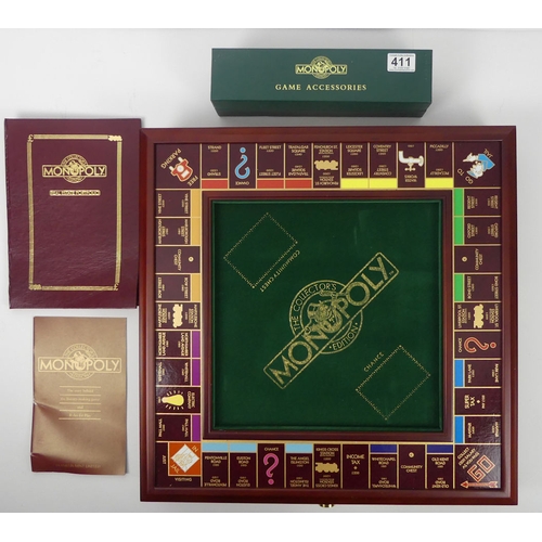 411 - A Franklin Mint limited edition Monopoly board game and accessories. H8cm x W53cm