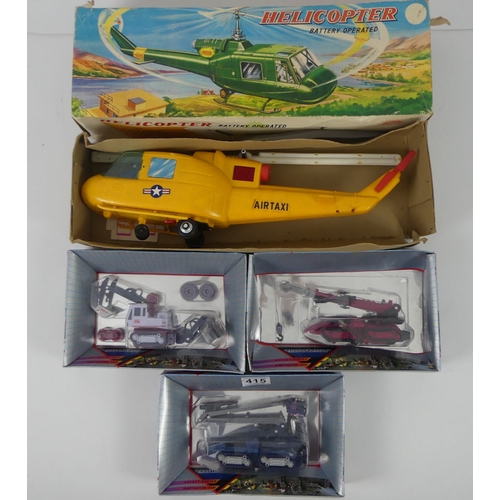 415 - A boxed Mic battery operated helicopter together with three multiimac generation II crane trucks.