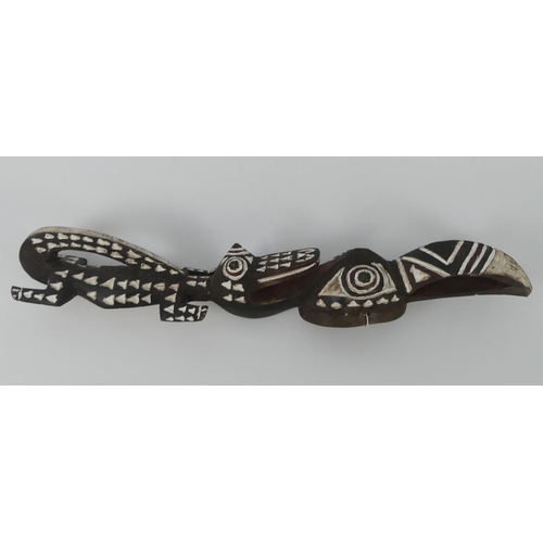 449 - A Burkino Faso carved crocodile and bird mask. 62 x 10 cm.