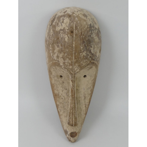 452 - A carved African Gabon Fang tribal mask. 40 x 18 cm.