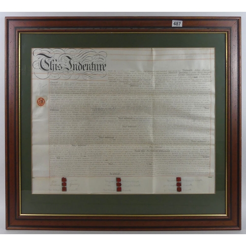 487 - Two framed and glazed 19th century indentures, together with an oil on canvas of a train signed John... 