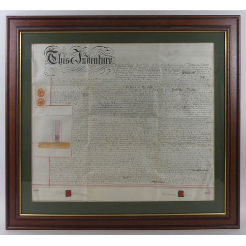 487 - Two framed and glazed 19th century indentures, together with an oil on canvas of a train signed John... 