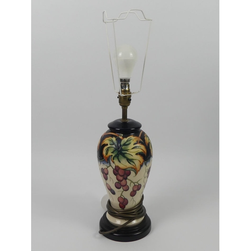 350 - A Moorcroft lamp 'Fruiting Vine' pattern, 57cm.