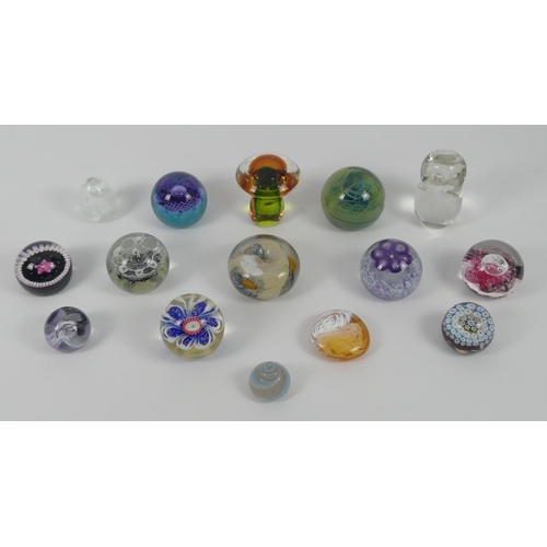 368 - Fifteen glass paperweights including Caithness, Langham, Mdina and Selkirk. Largest 12 cm high.