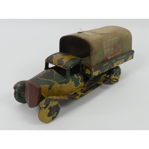 398 - A Mettoy clockwork tinplate army truck from the 1950's. 26 x 12 cm.