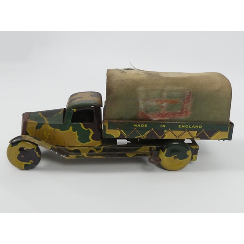 398 - A Mettoy clockwork tinplate army truck from the 1950's. 26 x 12 cm.