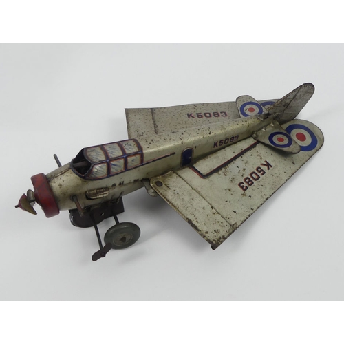 399 - A Mettoy clockwork tinplate RAF monoplane K5083 together with a Mettoy clockwork bi-plane. H14cm X W... 